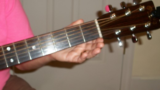 The 6th string closest to you, the thickest.