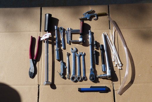 Changing spark plugs requires some common tools.  Source