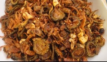 Fried bitter gourd before mixing with tomato salsa
