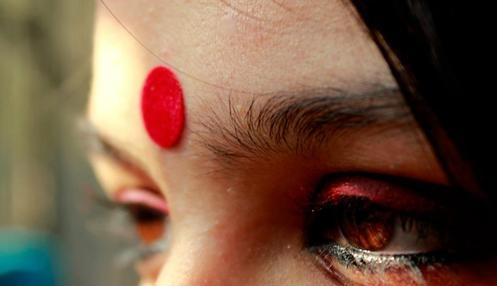The Red Dot dominating on my aunt's forehead.