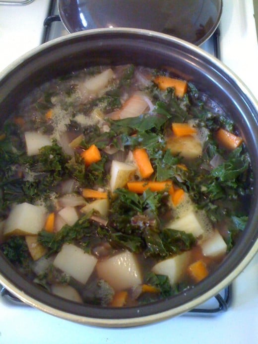 Look at all those colorful vegetables! Just need to add the cabbage and the spices, and let it simmer a bit