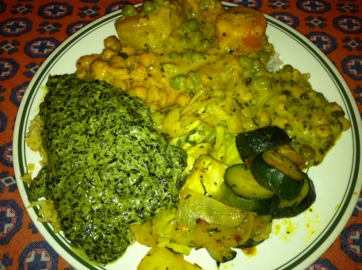 Indian Buffet with creamed spinach, zucchini, cabbage, and curried potatoes, peas, and carrots