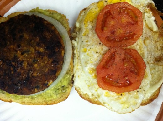 Veggie patty sandwich with tomato, onion, and avocado