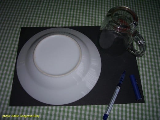 Using a bowl and cup to draw circles.