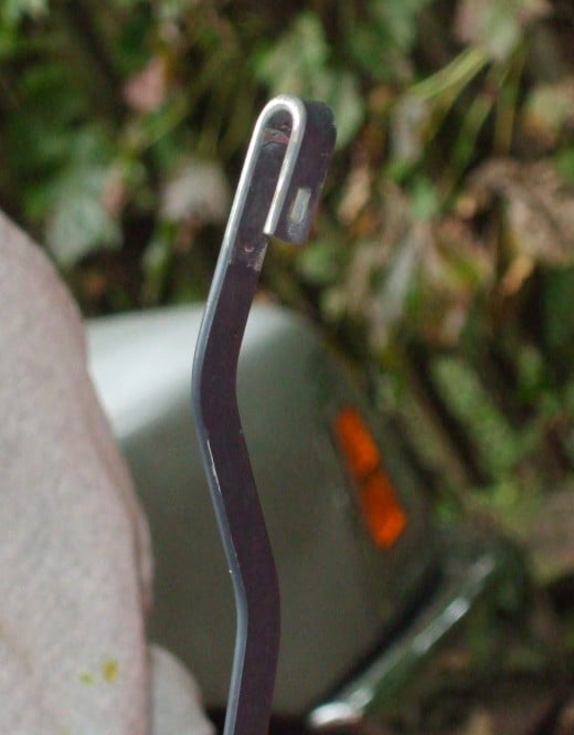The empty J-hook end of a windshield wiper arm. The empty J-hook end of a windshield wiper arm.