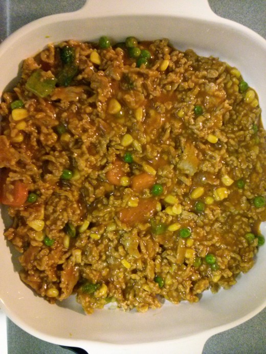 I can just eat this mixture! We've got ground meat, tomato soup, and frozen vegetables all mixed into one!