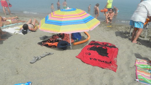 We bought our own umbrella . It gets very crowded in summer but nice & relaxed after the holidays