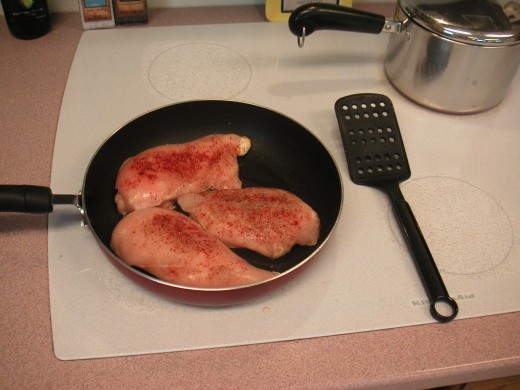 Heat one tablespoon of olive oil in a non-stick skillet and add the seasoned chicken.