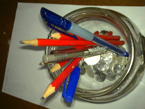 lots of writing tools in recycle jar