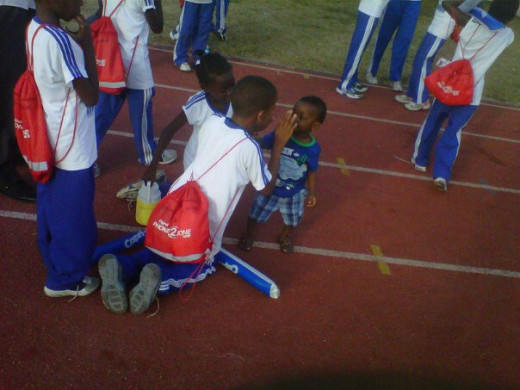 My toddler out and about with some kids at a prep athletic championship