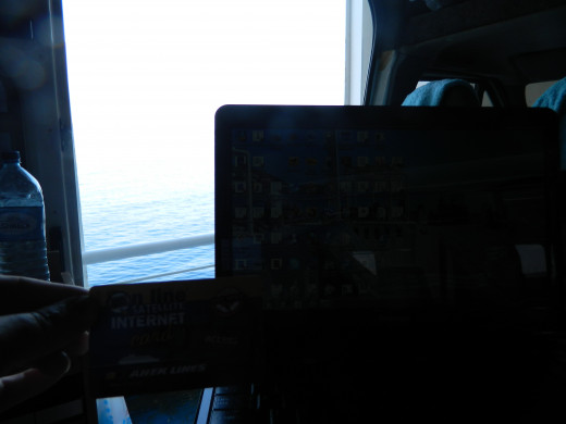 With a laptop you can work anywhere these days. This is on a ferry from Greece to Venice. 