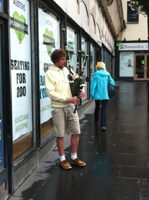 A piper busking