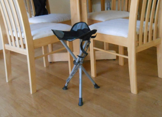 The Slacker Chair shown next to kitchen chairs