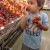 Helping me pick out peaches…he's smelling them. Helping me pick out peaches…he's smelling them.