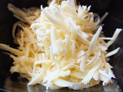Shred the cheese and set aside. Did you know that preshredded cheese has a chemical on it that keeps it from sticking together in the bag? 