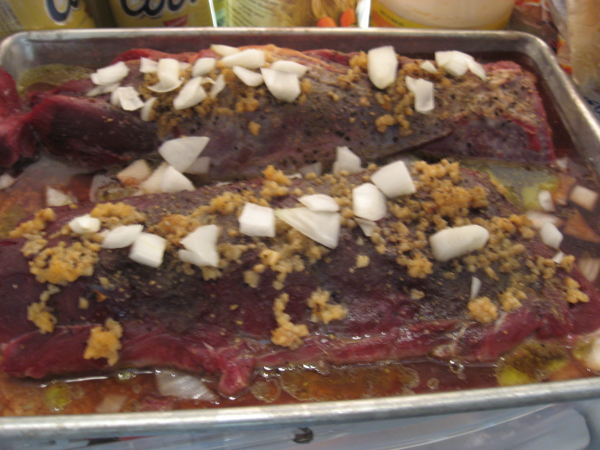 Marinate it in the marsala wine. Notice the chopped onions and garlic on the meat.