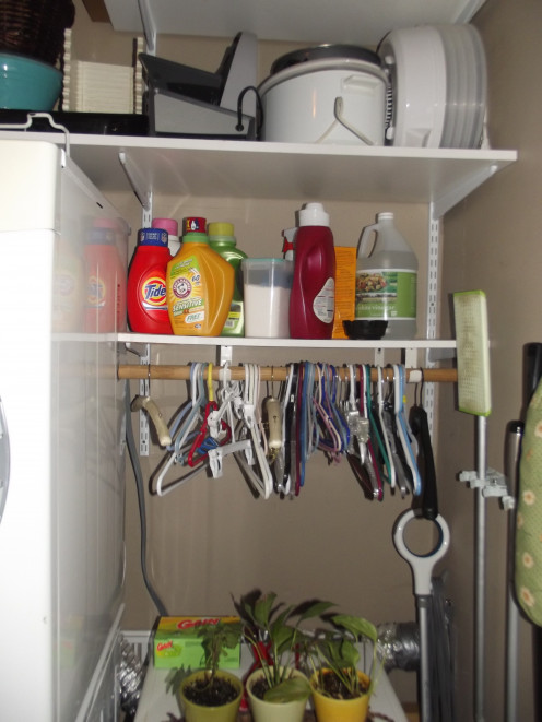 These shelves hold all of my laundry supplies and important as it is, it also makes the room look cluttered.