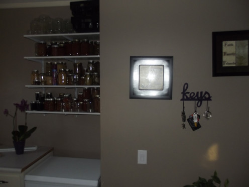 These shelves hold all of out home-canned goods.  Again, I love the convenience and frugality of the open shelves, but I don't want everything on display all of the time.