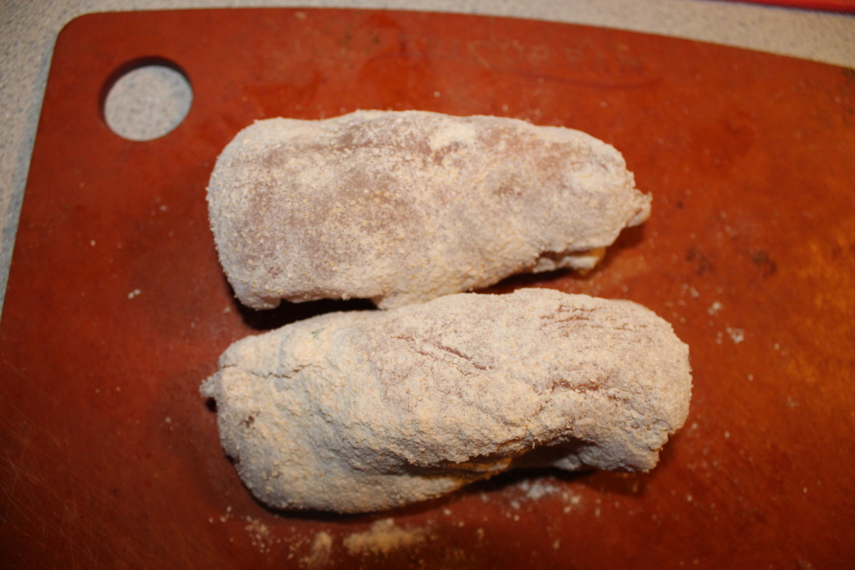 The chicken breasts are rolled in flour and ready to chill in the fridge for 10 minutes, before they are breaded and deep-fried.