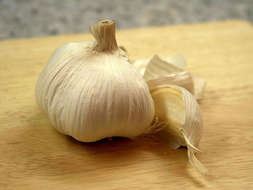 A big garlic clove!  Garlic pepper, salt, or just a tiny bit of chopped garlic can be great on a grilled cheese sandwich!