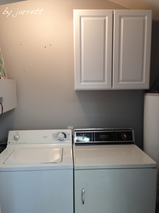 Wall painted and cabinet installed. (We did go back and fill in the holes and paint those spots)