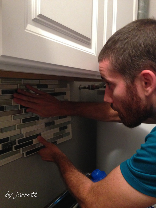 My husband installing the tile! 