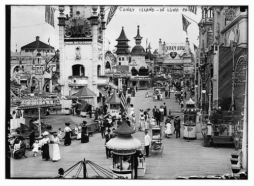 Inside one of the Gates to Luna Park ~1910 (notice the wording on the sign is backwards, indicating no sign backing).
