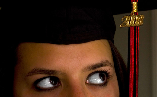 Girl thinking with graduation cap