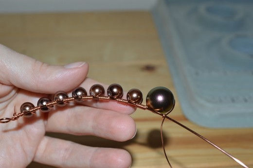 This is the halfway point on my design. See how I have attached the larger bead in exactly the same way.
