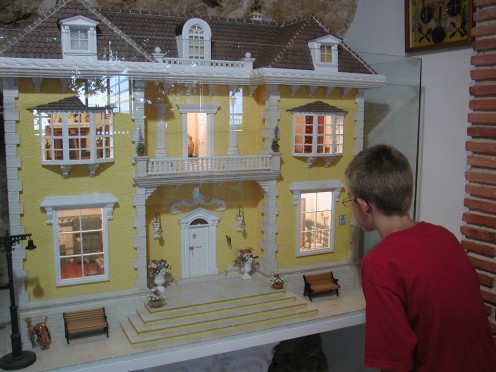 My other grandson looking at one of the many doll's houses