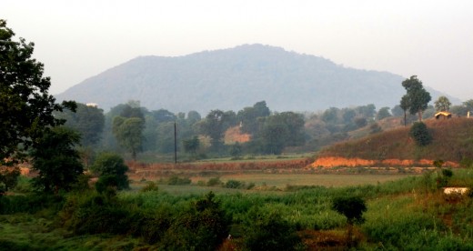Kamad Giri Hill, which resembles a bow, is seen at a distance