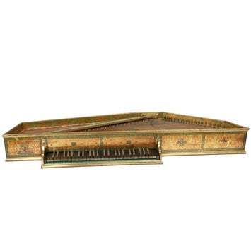 A instrument like this is called a spinet when it has legs and a virginals when it is just a table top case instrument. Queen Elizabeth was reputedly an accomplished player.