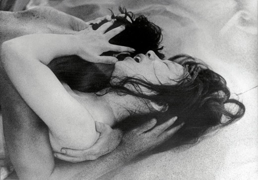 An entomologist (Eiji Okada) and a mysterious Woman (Kyōko Kishida) share an intimate (and appropriately sandy) moment in Hiroshi Teshigahara's Woman in the Dunes (1964) 