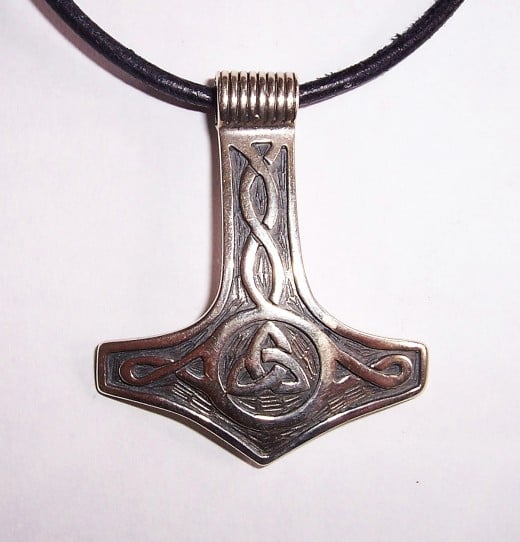 Mjoellnir, Thor's hammer stylised pendant and neck ring - in legend Thor threw a very large, more solid hammer at the giants' foreheads to gain the upper hand 