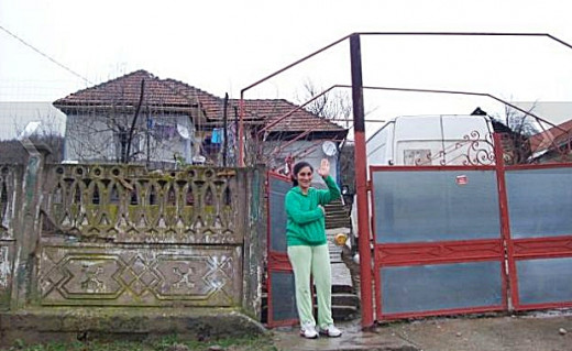 Maria Lazar in front of their new house