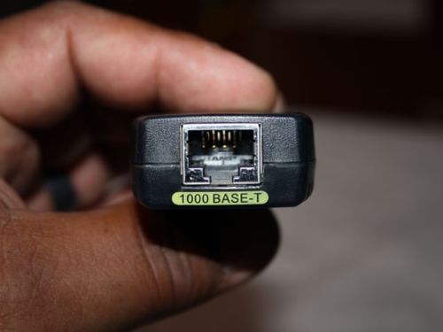 And THIS, is the GBIC - Gigabit Interface Connection Module.  Got to plug ONE of these in for each port.   But, I've got two of these ports on the C3550, and 8 here!  ... 