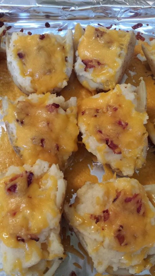Everything's better with bacon. Twice-Baked Potatoes: bake whole potatoes until they start to become squishy. Halve.  Scoop out insides - mix with buttter, milk, salt, cheese, browned onions. Top with bacon and cheddar cheese.