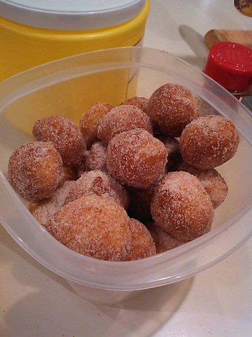 Can of biscuit dough broken into balls and fried until brown (very short cook time).  Then dunk them in chocolate or a sugar mixture.  (Don't use baking soda that was mislabeled as powdered sugar...)