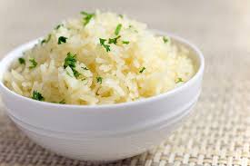 Here we have a bowl of hot buttered rice topped with fine diced chopped parsley.