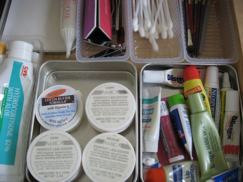 Save plastic or metal lids or containers to sort your cosmetics into. These are free and you keep them out of the landfill. Here's how it looks in one of my drawers. Best of all, I can see what I want at a glance, since it separates products by type.