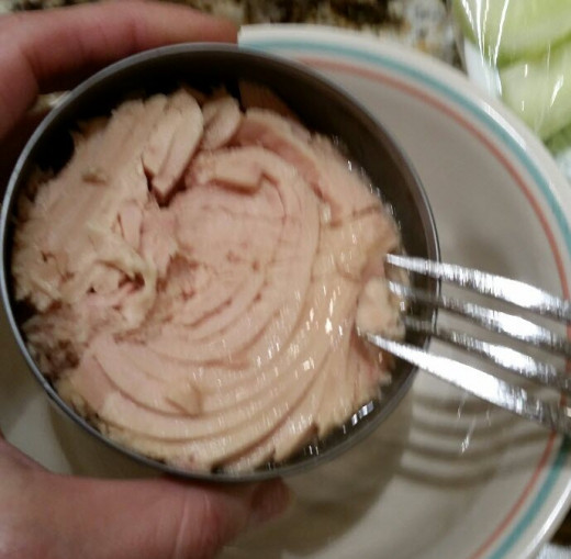 Drain and remove tuna from can.