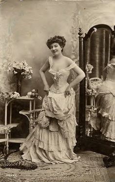 Victorian woman in tight corset and multi-layered dress 