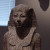 A statue of Hatshepsut. A beautiful red granite statue that almost has a smile on its face. A statue of Hatshepsut. A beautiful red granite statue that almost has a smile on its face.