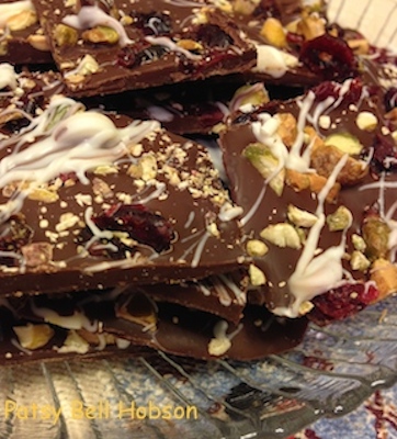 Combine rich dark chocolate with chopped, toasted pistachios and dried cranberries. Cut in 2" squares.