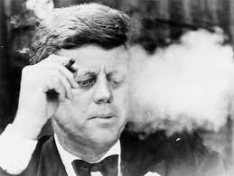 With Fidel fretting away in Havana with a cigar in his trembling hand, his arch enemy JFK hides himself in a cloud of cigar smoke; one finger on the nuclear button and the other on the hotline to Nikita in Moscow.