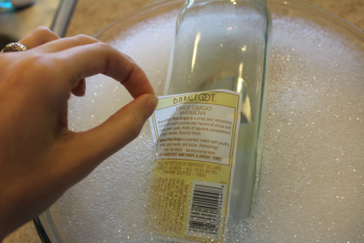 Peel the labels off after soaking.