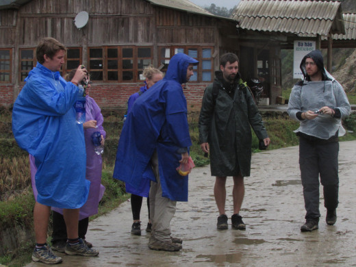 Our trekking group warding off the rain