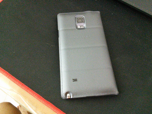 Take a look at the bottom left of the phone's back where the speaker is located.