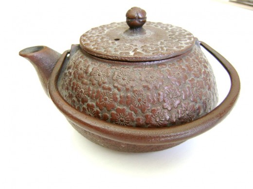 Cast iron tea kettle.