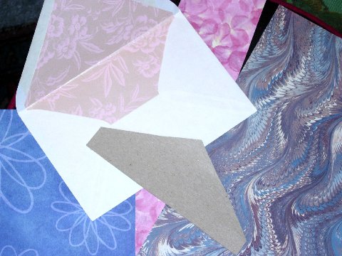 Lined envelope showing a Cardboard Template and various suitable Papers